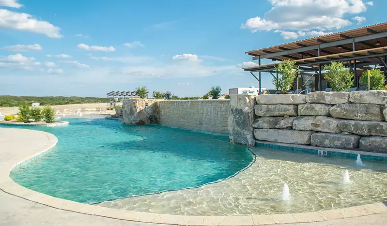 Lower pool with splash pad at Firefly Resorts