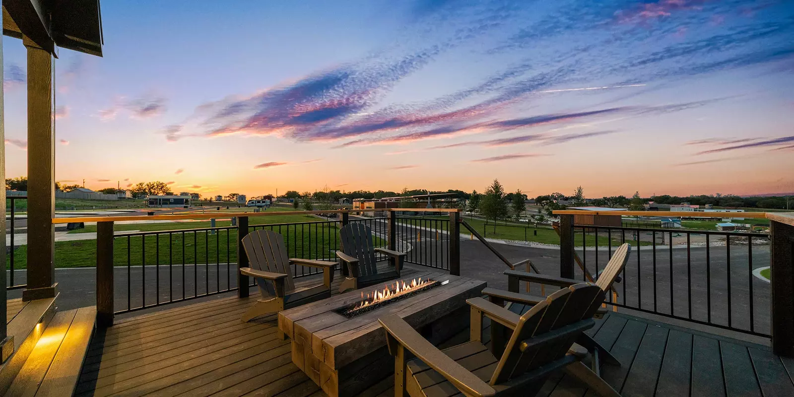 deck of tiny home with fire pit