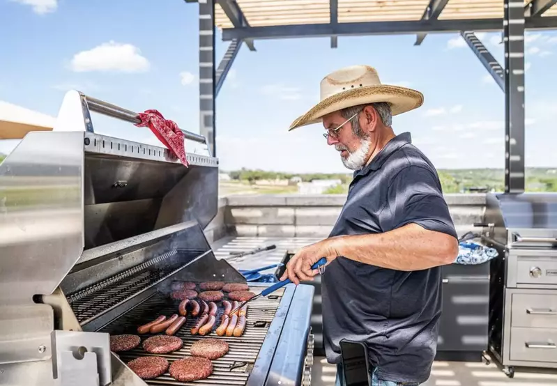 man grilling at Firefly